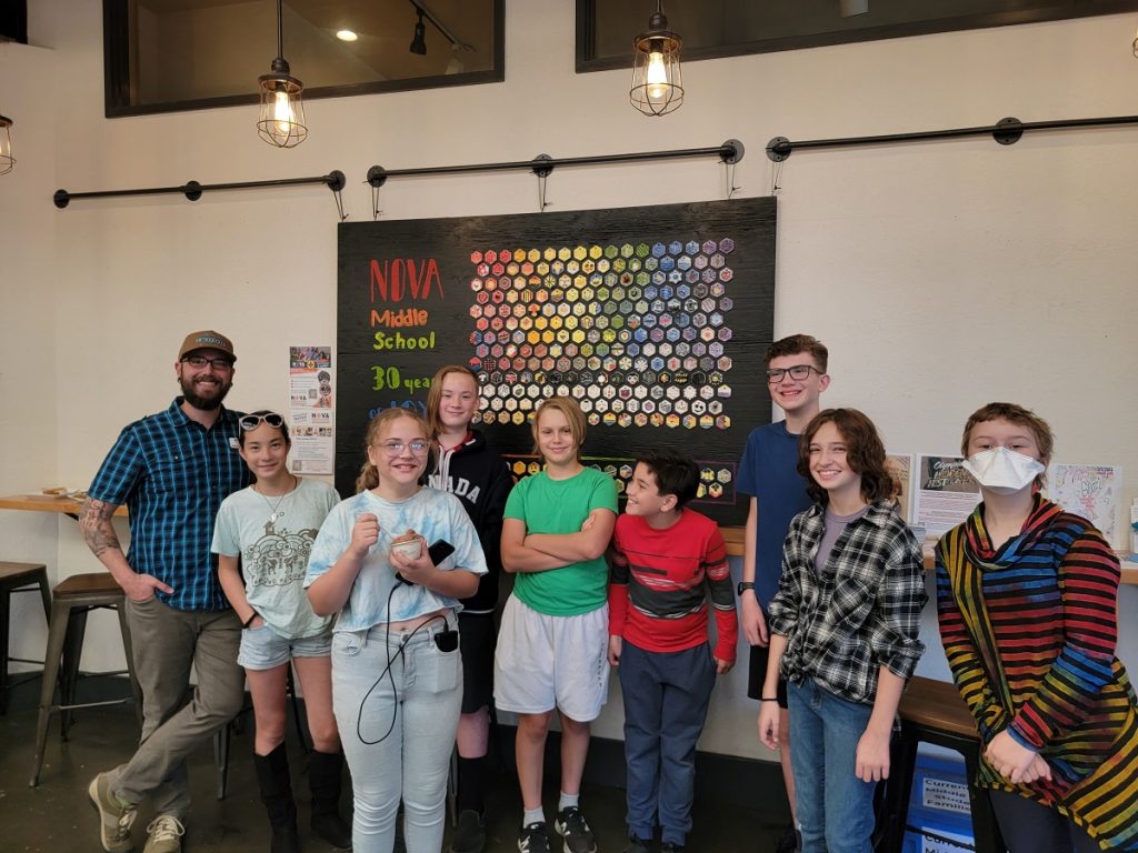 a group of students and a teacher at NOVA middle school