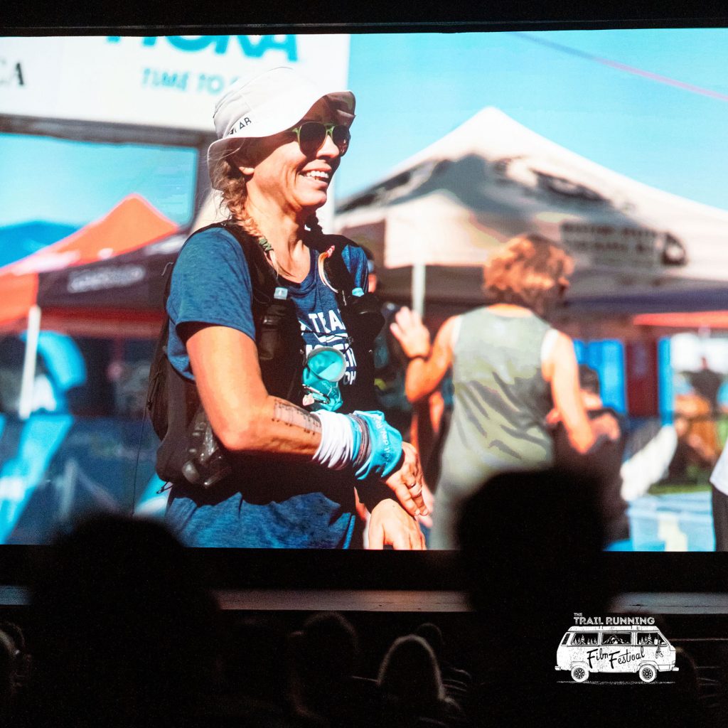 Photo of a woman trail runner on a large screen