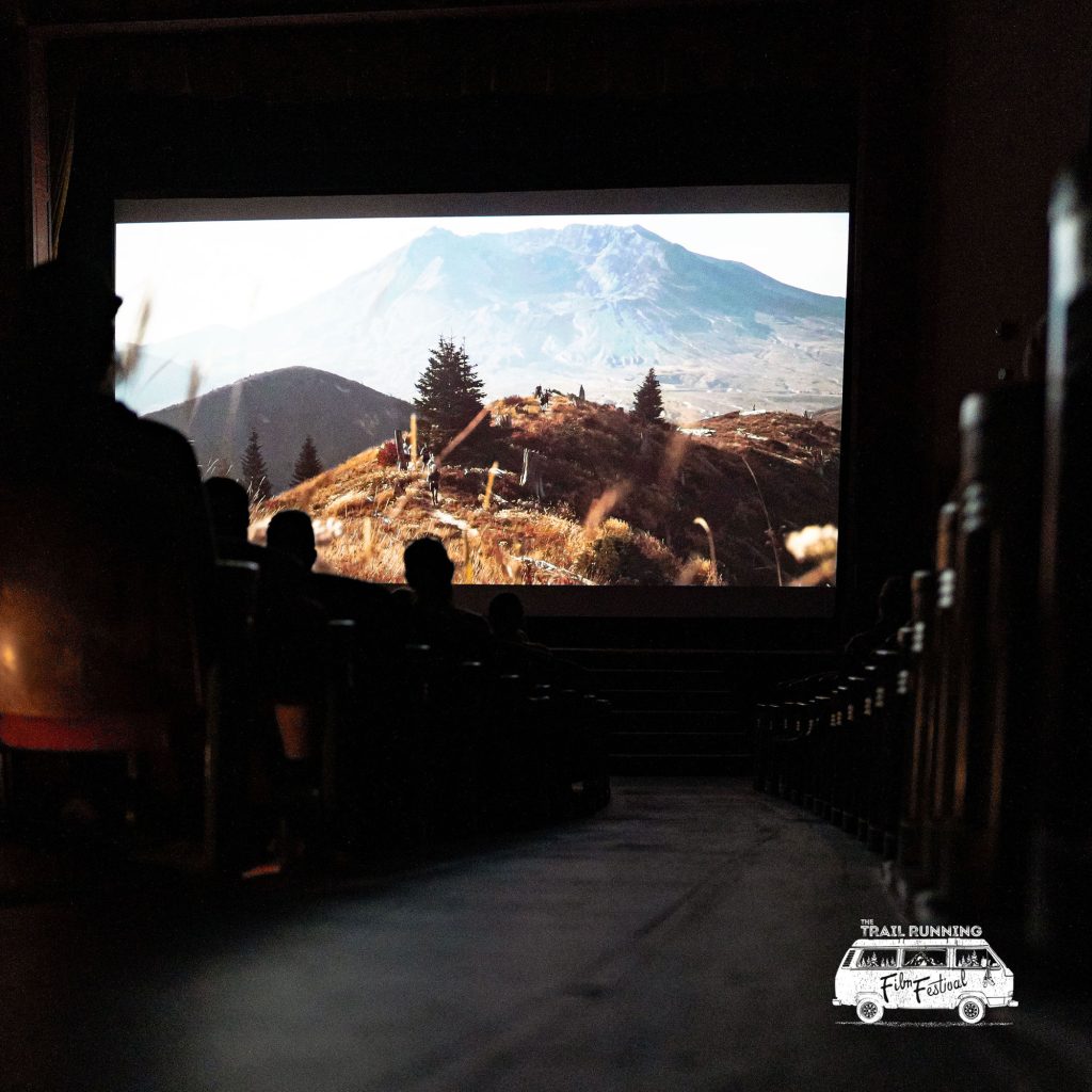 photo of a mountain landscape on a big screen during the Trail Running Film Festival