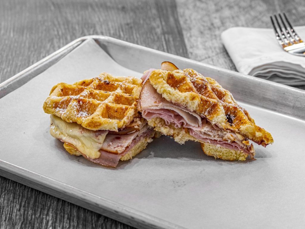 ham and gilled-cheese sandwich with waffles as bread