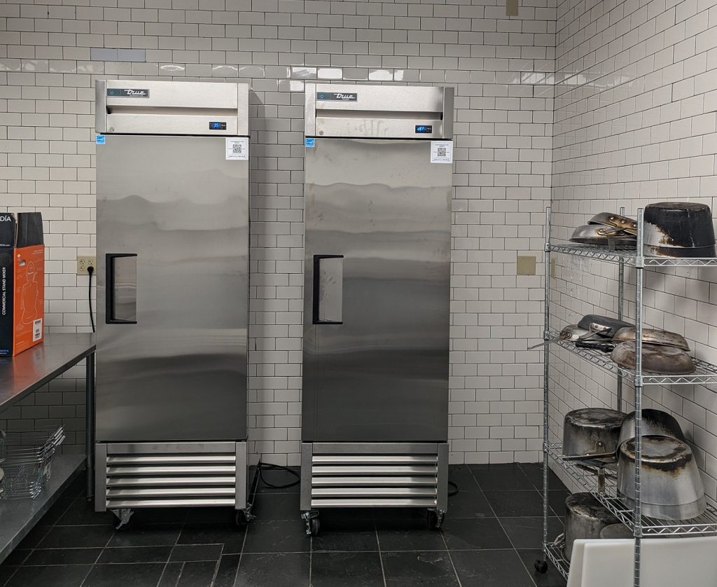 Two tall commercial refrigerators