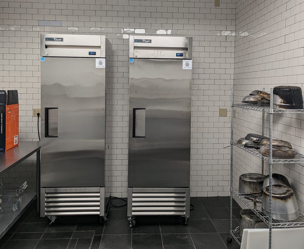 Two tall commercial refrigerators