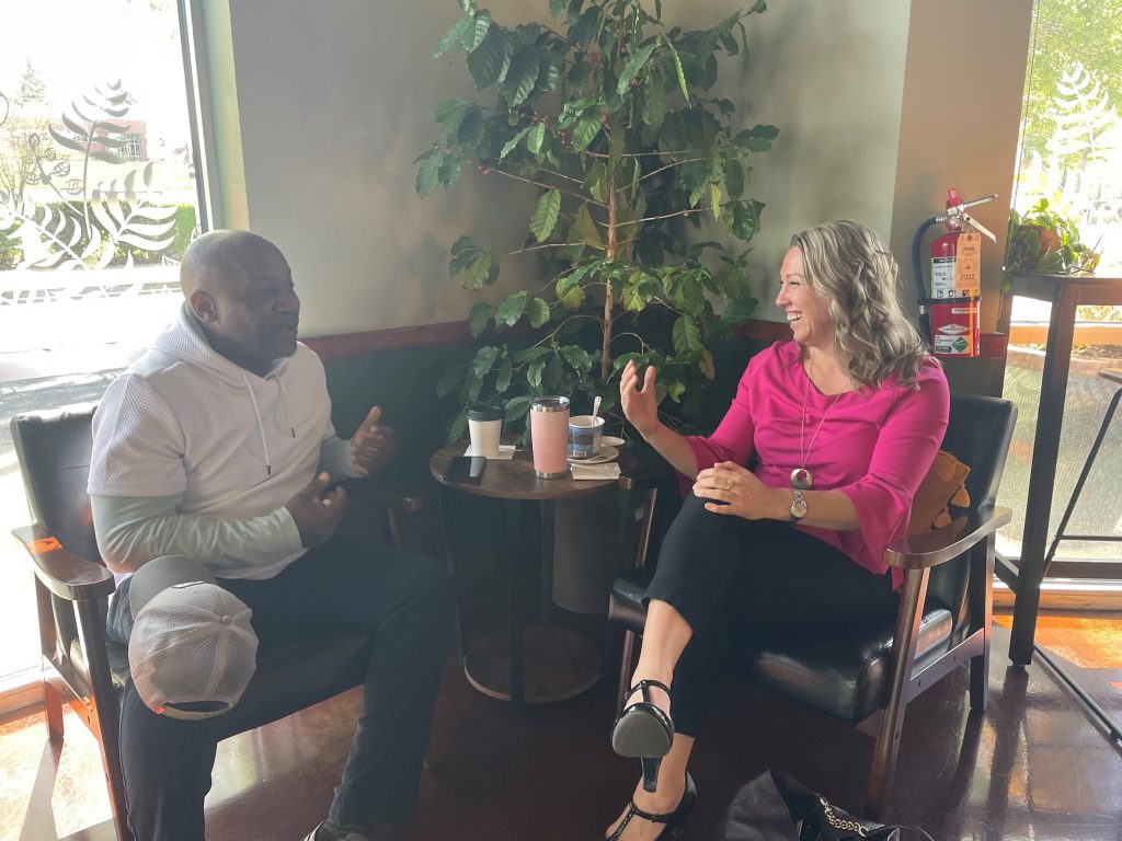 Deputy Mayor Malcolm Miller and Carrie Whisler in chairs talking