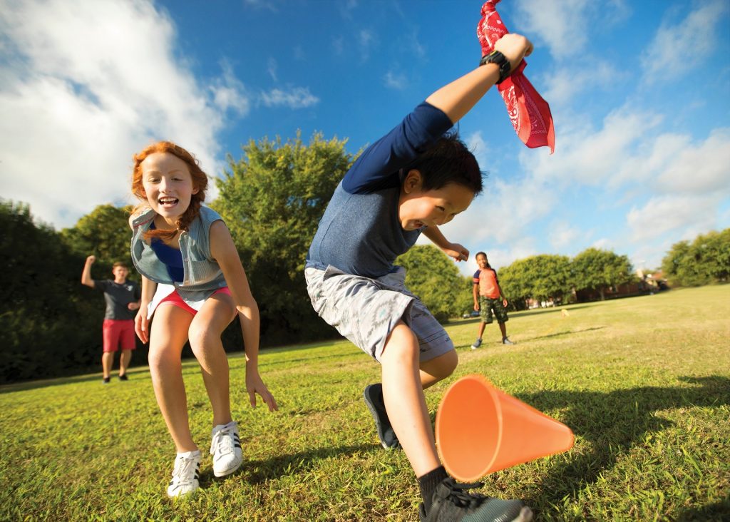 kids playing in the grass