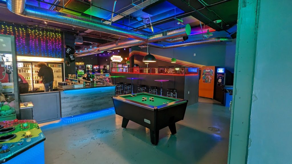 inside Legends Arcade with a food bar, pool table and games.