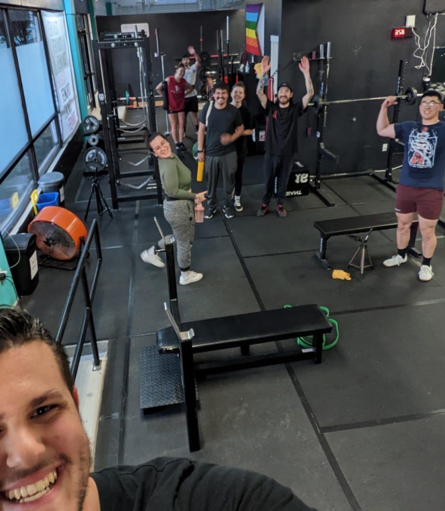 a man taking a selfie inside a gym