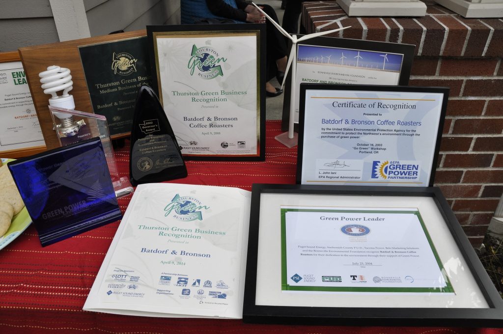 a group of plaque awards on a red tablecloth.