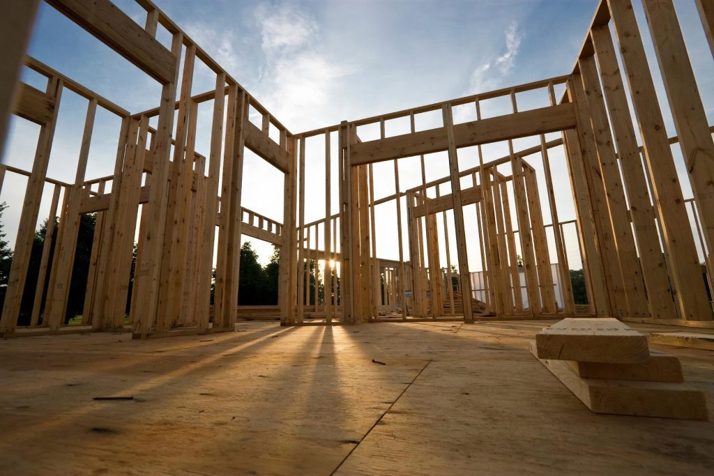 Frame out a house being built at sunset