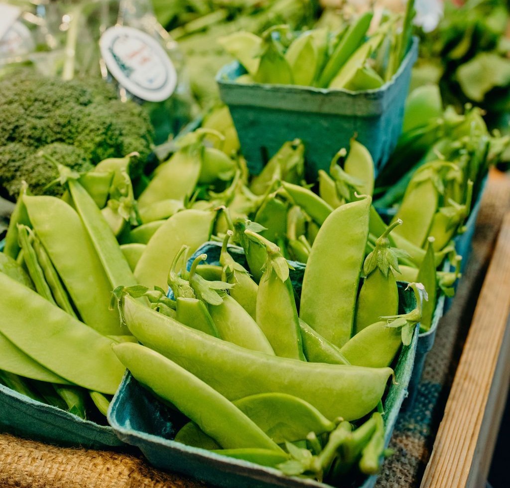 snap peas in green containers