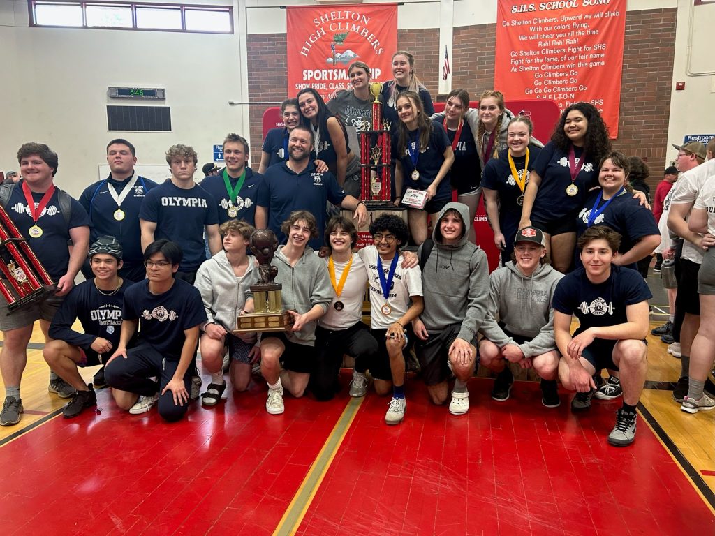 group photo of the Olympia powerlifting team