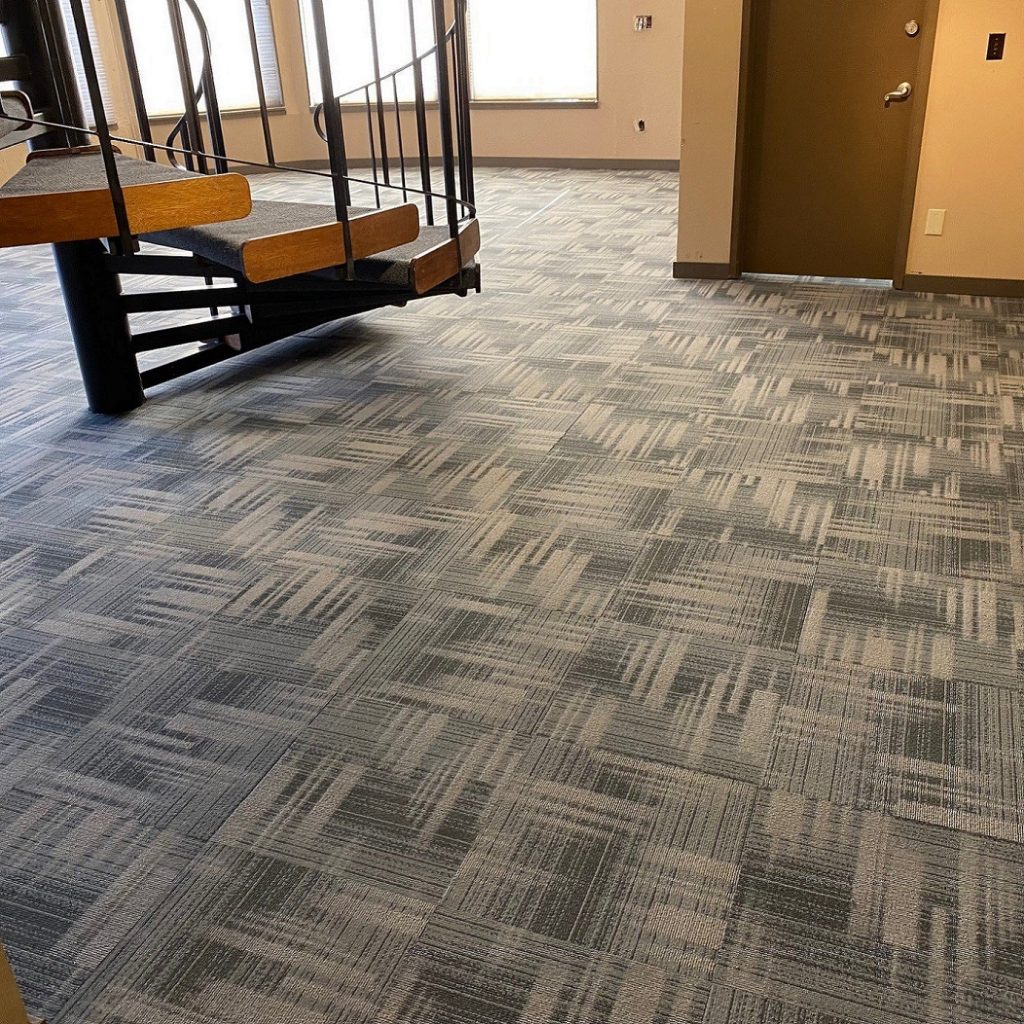 low-pile carpet with a spiral staircase on it