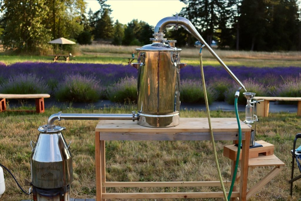 a small distilling table in a field