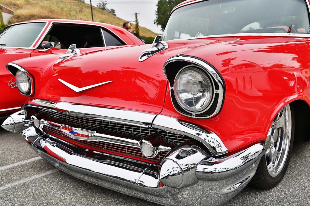 close up of the front of a red classic Chevy car