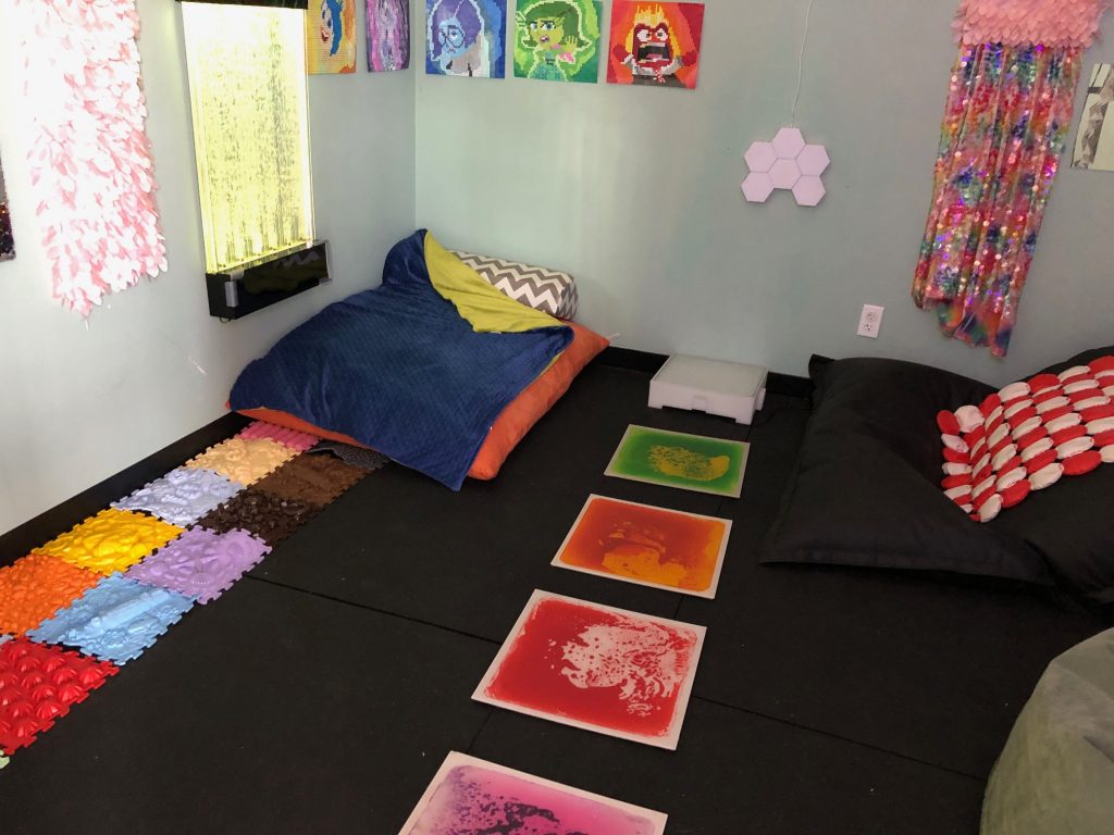 Sensory space with carpet, blankets, different texture items on the floors and walls