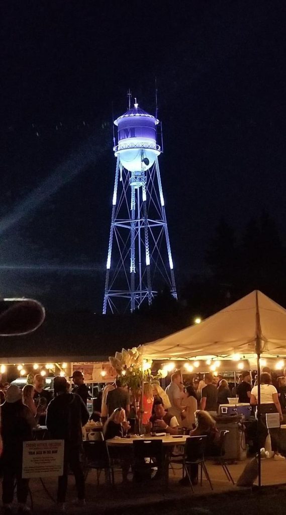 Yelm water tower lit up at night