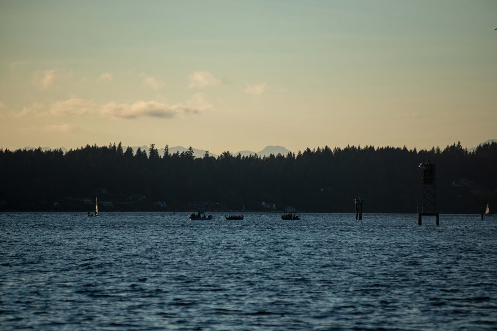 Squaxin Island Tribal members in canoes on the puget sound