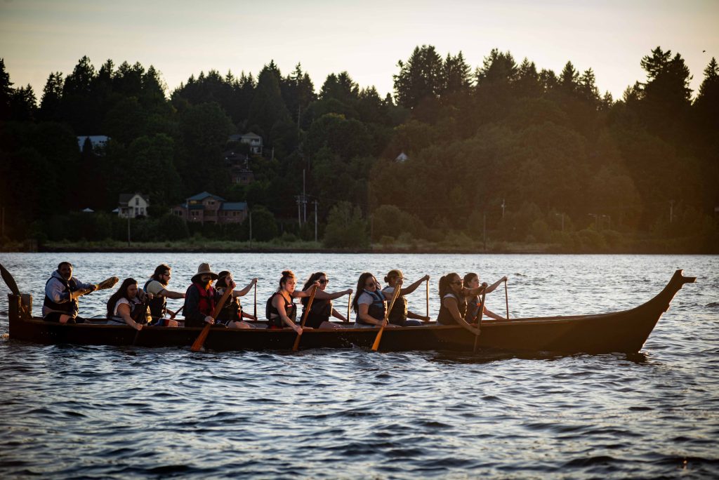 Squaxin Island Tribal members in canoes on the puget sound