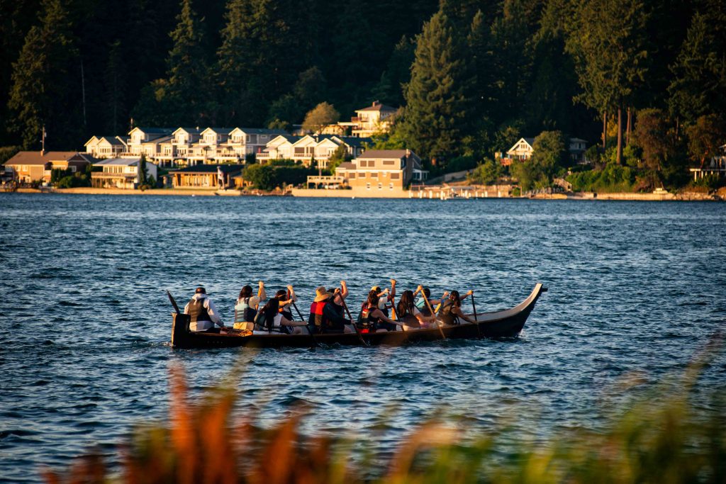 Squaxin Island Tribal members in canoes on the puget sound