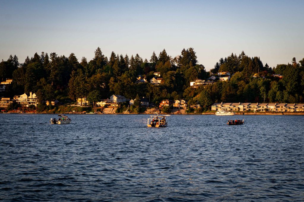 Squaxin Island Tribal members in canoes on the puget sound