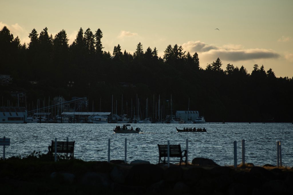 Squaxin Island Tribal members in canoes on the puget sound