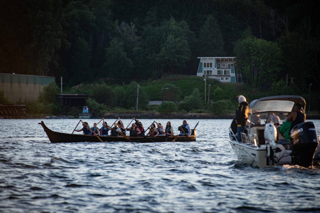 Squaxin Island Tribal members in canoes on the puget sound
