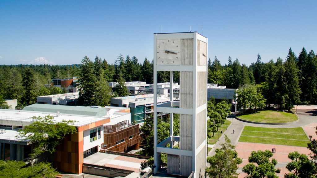 aerial view of The Evergreen State College with it's large clock tower 
