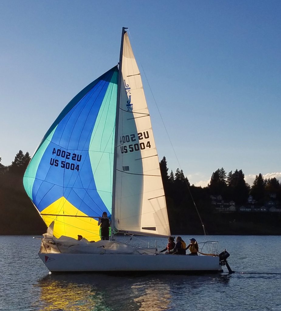 Sail boat on the water at sunset