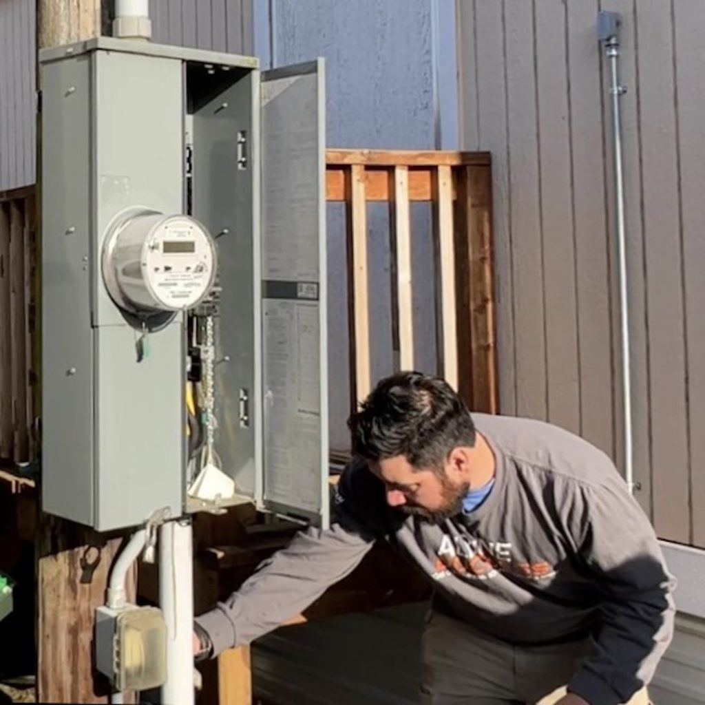 electrician working on an outdoor panel