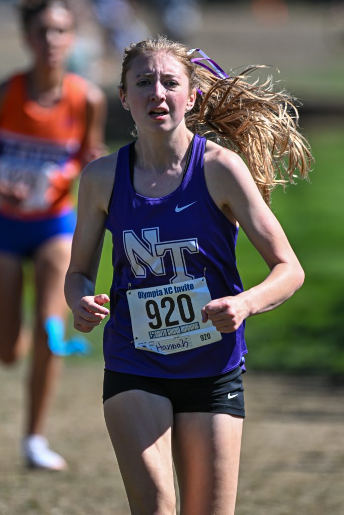 high school athletes running cross country at a meet