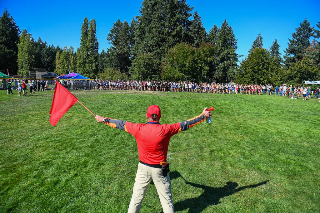 high school athletes running cross country at a meet