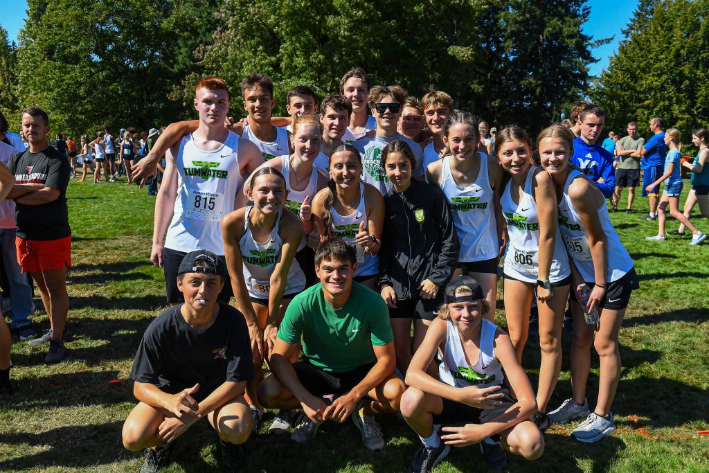 high school athletes running cross country at a meet