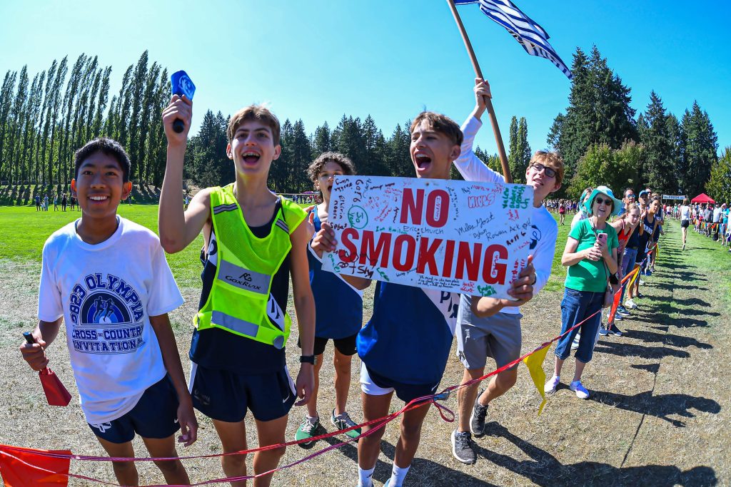high school athletes running cross country at a meet