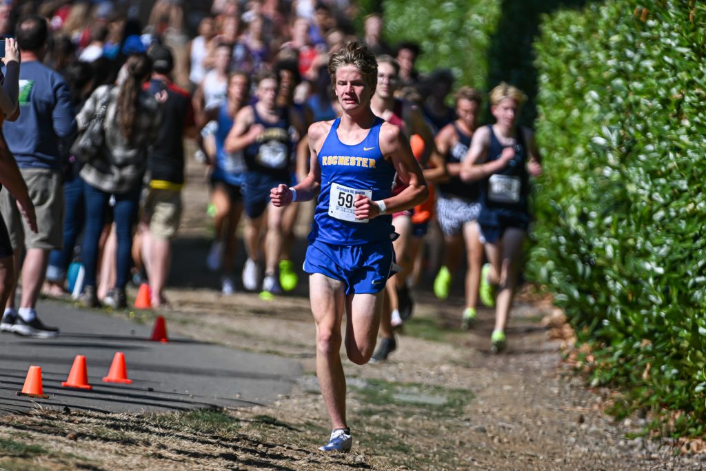 high school athletes running cross country at a meet