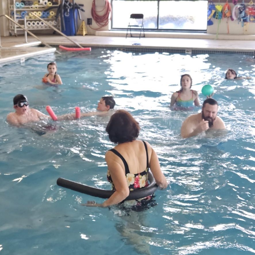 a bunch of kids in an indoor pool at South Sound YMCA