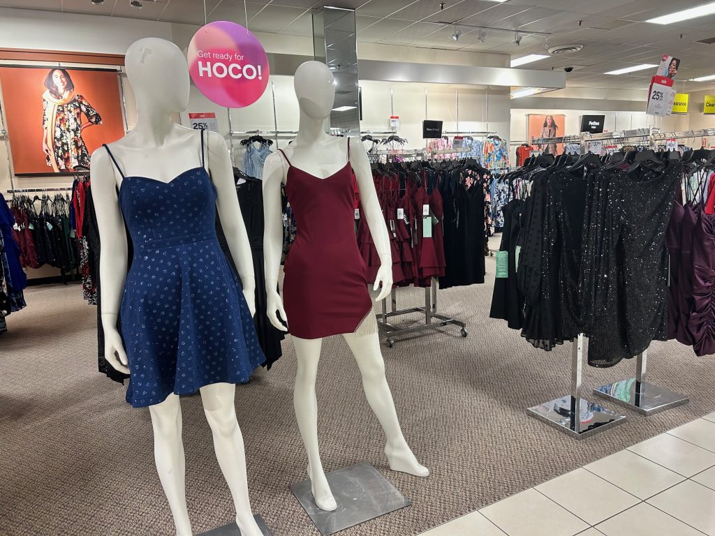 formal dresses on racks and mannequins at JC Penney's