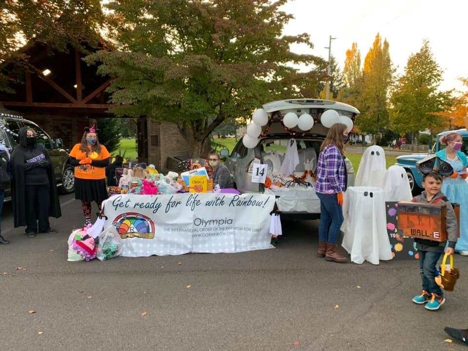 a car all decorated for the Masonic Trunk-or-Treat in Tumwater with lots of ghosts.