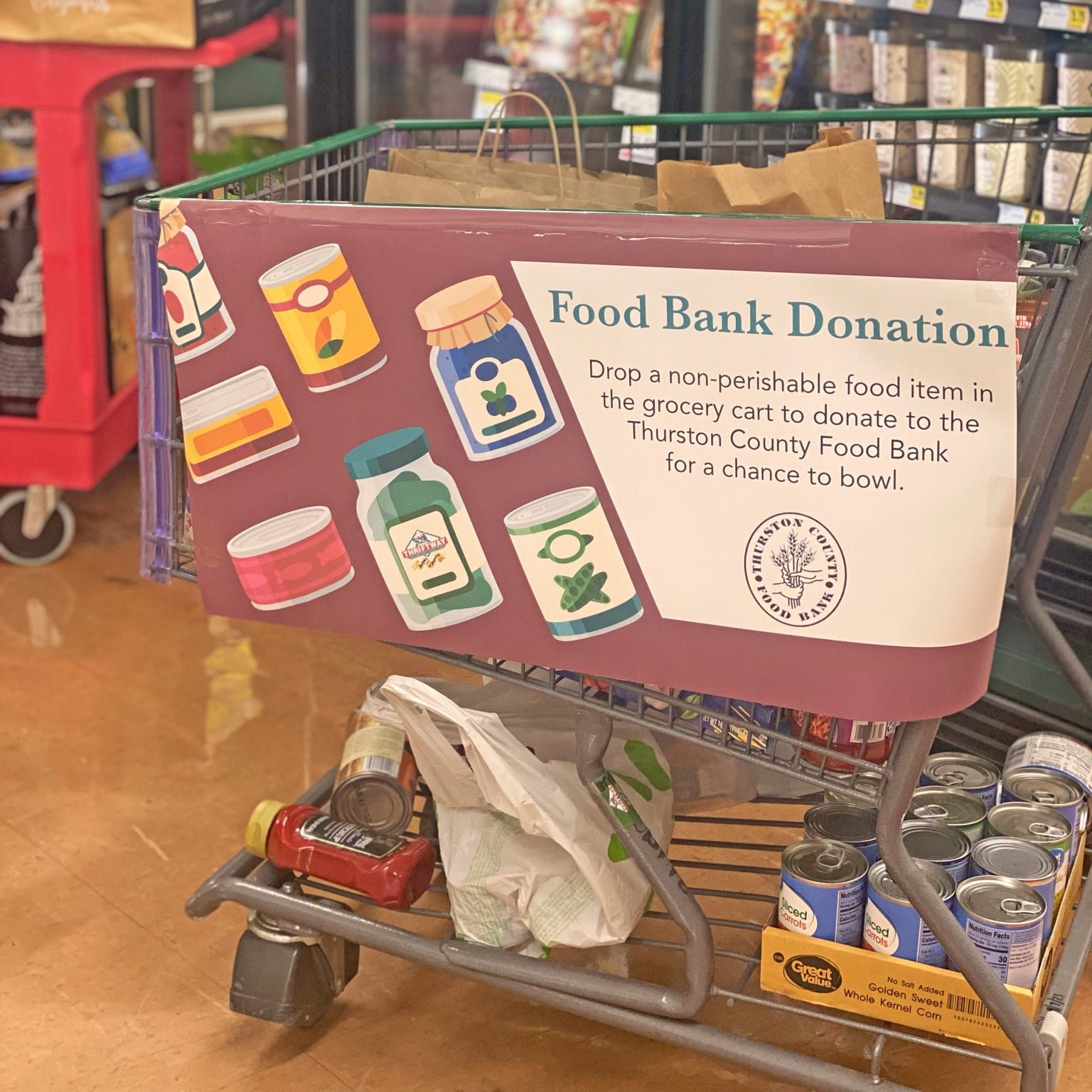 Thriftway grocery cart with a sign that says 'Food Bank Dona'