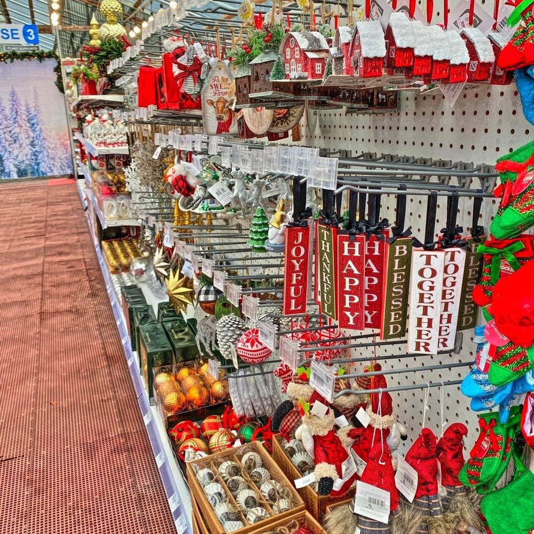 an aisle full of all kinds of Christmas ornaments and other hanging decorations at Lincoln Creek Lumber in Tumwater