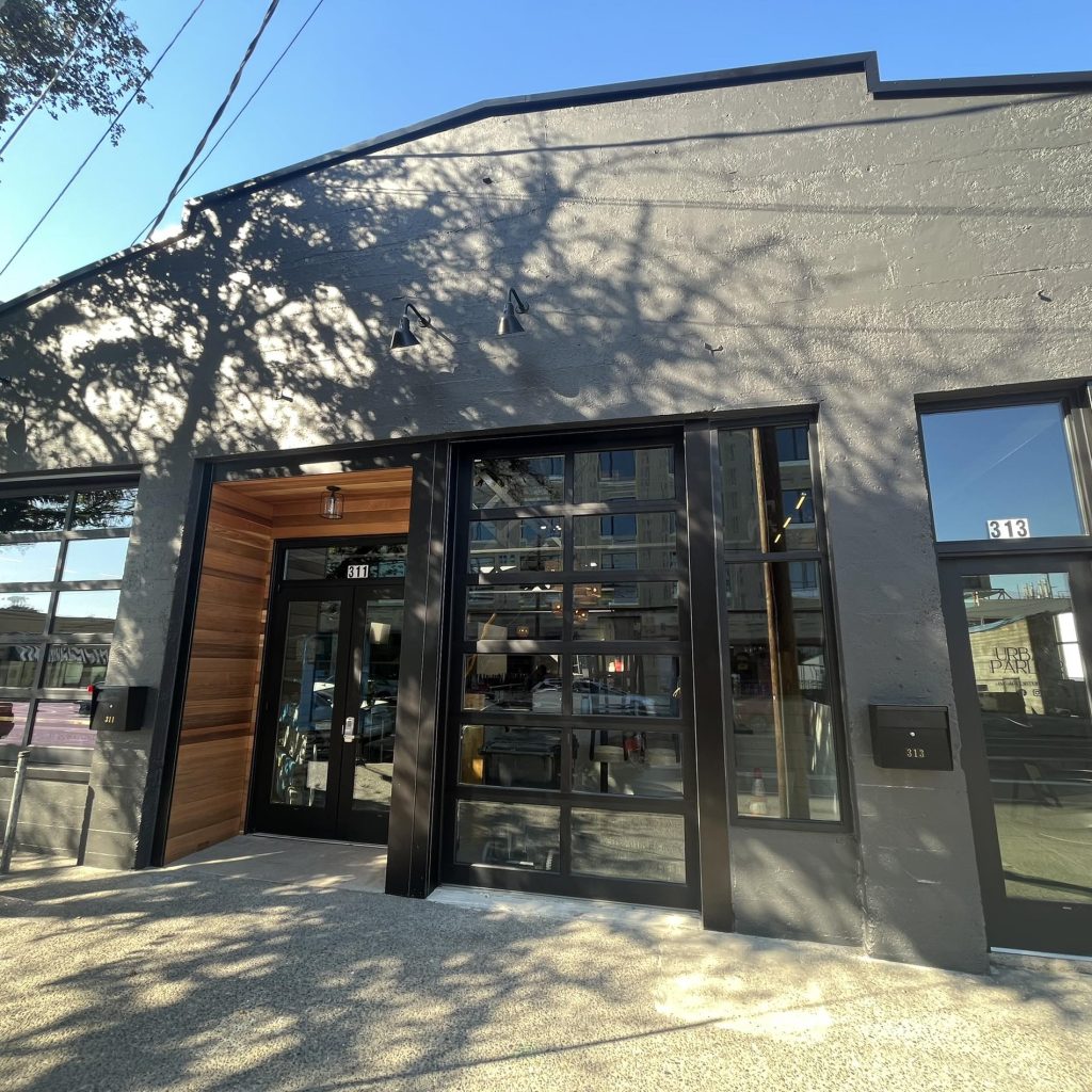 Outside of Cove Restaurant with big glass windows and wood framing