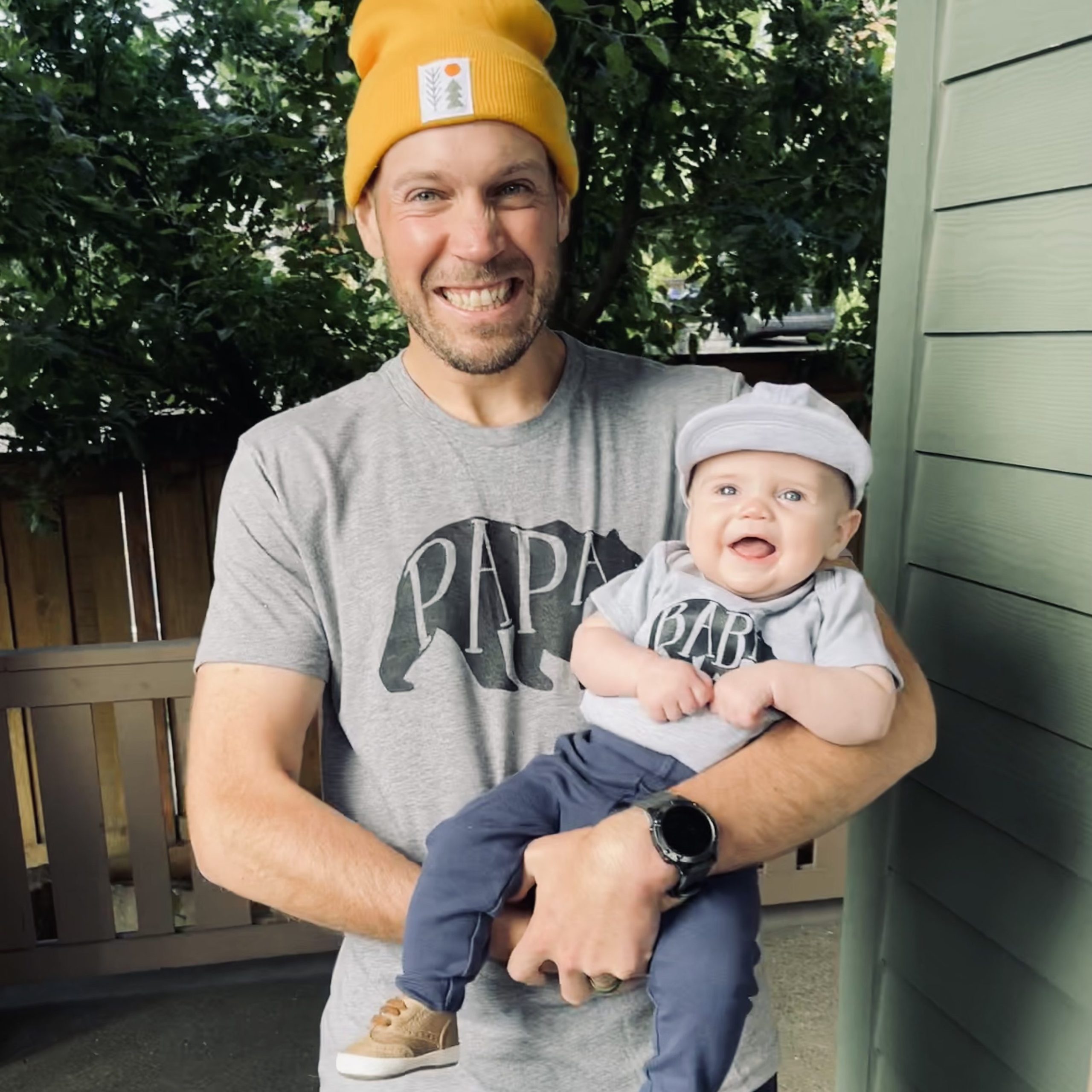 Dr. Justin Anderson holding a smiling baby