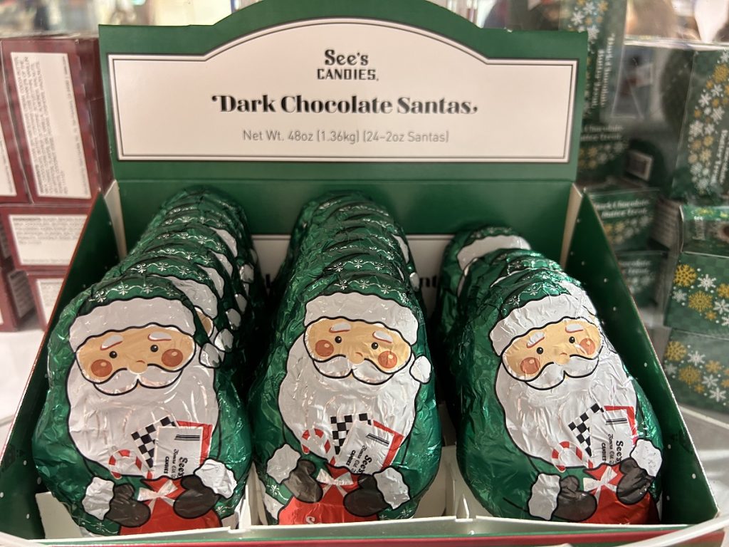 dark chocolate santas in a See's Candies display box