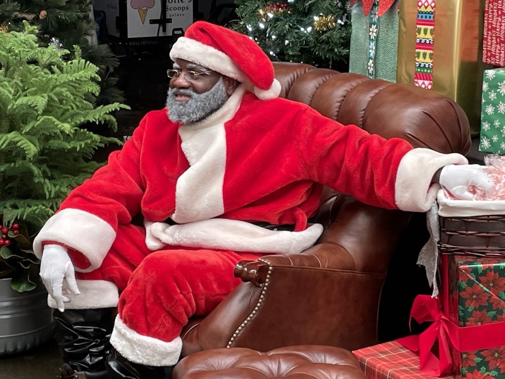 African-American Santa Claus sitting in a leather chair