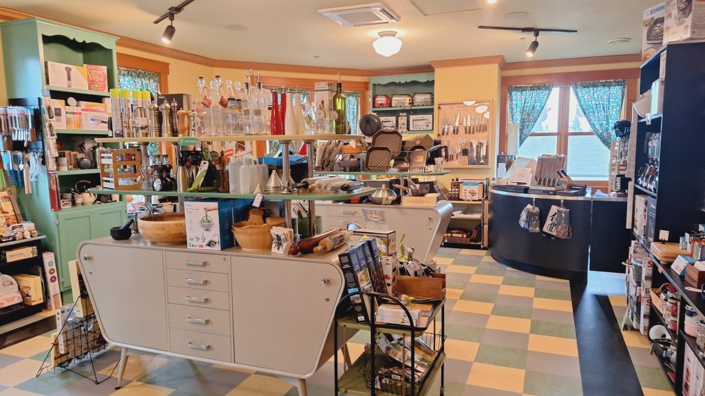 Inside The Rolling Pin, with an assortment of kitchenware items on every shelf and table top