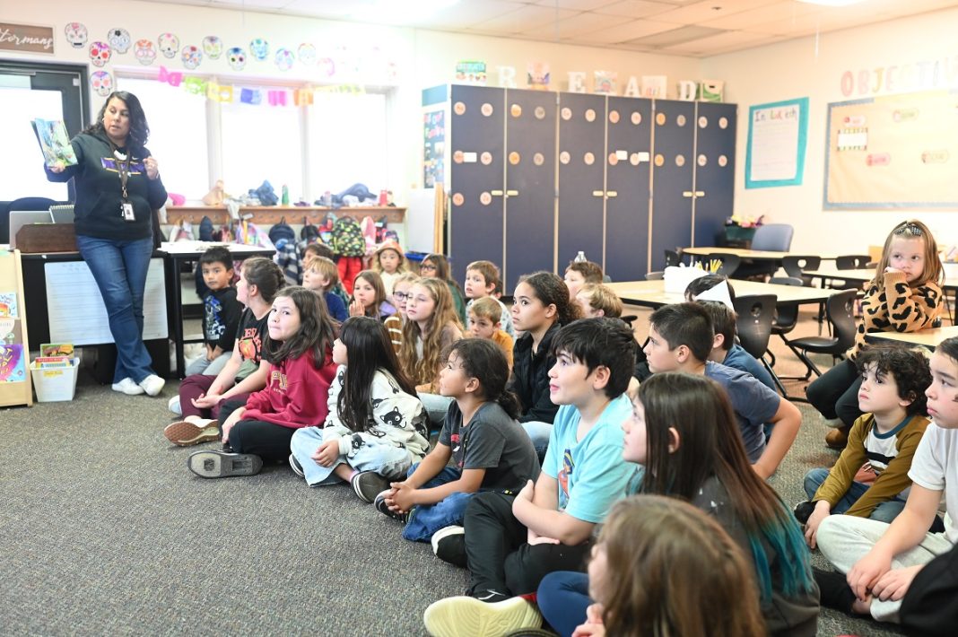 large group of kids sitting on the floor