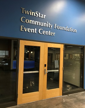 Photo of a double doored room in SPSCC with the words, 'Twinstar Community Foundation Event Center' above them
