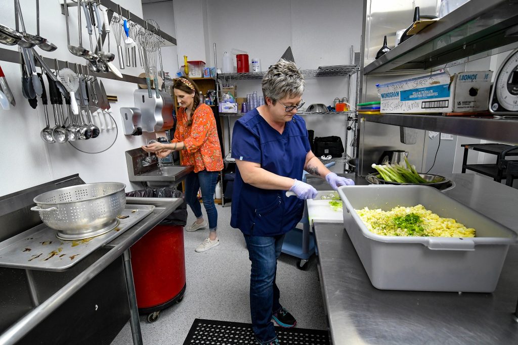 People preparing food in a kitchen