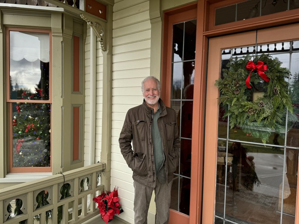 Brian Cullin standing on the porch by the door of the Worthington Mansion