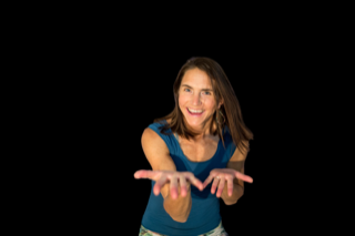 Betsy Winter in a tank top against a black background