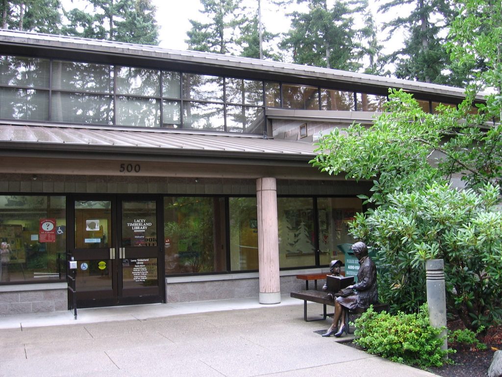 Lacey Timberland Library building with trees next to it