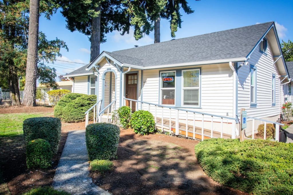 outside shot of Hometown Property Management's headquarters, a white house in lacey